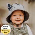 Load image into Gallery viewer, Toddler in a Bedhead Tiger Grey Marle Bucket Hat featuring a soft brim and adjustable chin strap, perfect for sun protection and comfort during outdoor adventures.