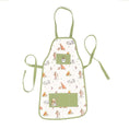 Load image into Gallery viewer, A charming children's gardening apron featuring Winnie the Pooh and friends' design. Made from 100% sustainably sourced cotton, it includes four green pockets, neck loop, and waist ties, suitable for children aged 6-11 years. Presented with a recycled belly band.