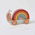 Load image into Gallery viewer, Rainbow-colored pull-along snail toy made from natural wood with non-toxic paint. Ideal for toddlers aged 12 months and up, designed to encourage walking and hand-eye coordination.