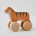Load image into Gallery viewer, Wooden Rolling Tiger toy made from natural wood with non-toxic paint, perfect for encouraging crawling and walking in young children.