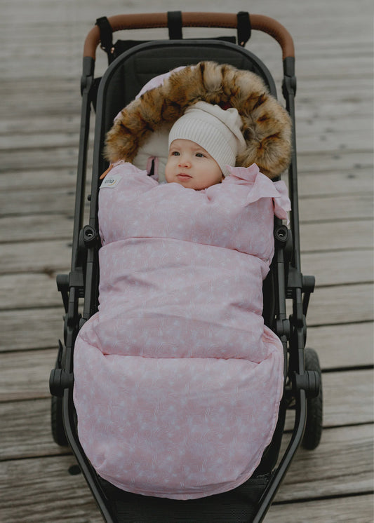 Nordic Footmuff Pram Liner in Pink Feather design, suitable for all weather, reversible, fits all prams, for newborns to toddlers.