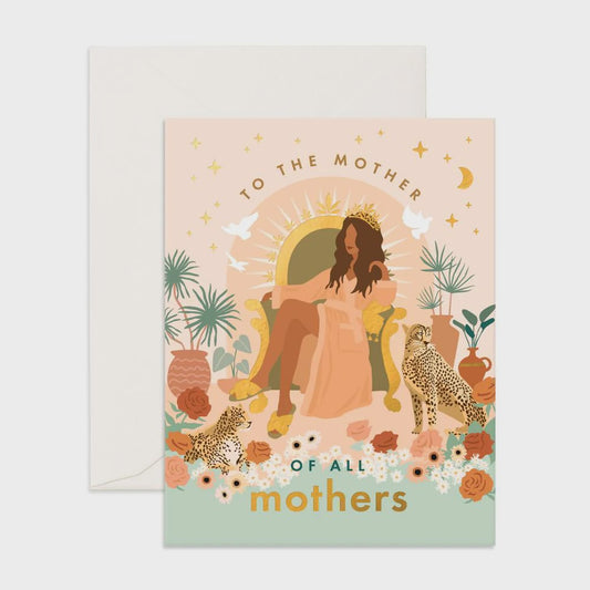 A woman sits on a throne, wearing a regal crown. She is surrounded by a lush floral environment, and two felines rest at her side. White doves flutter around her, carrying messages of love and gratitude. The text reads: ‘To the mother of all mothers.