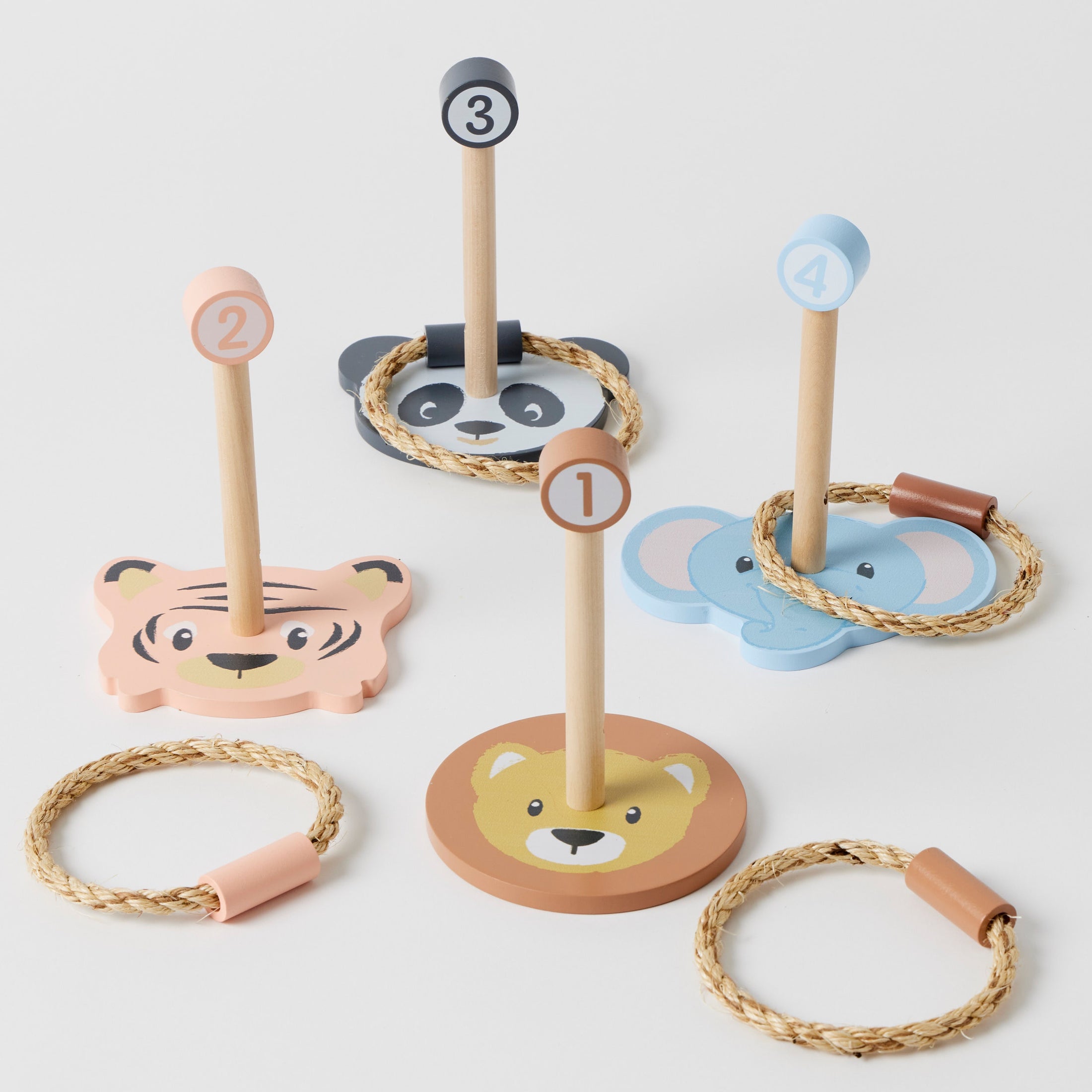 Studio Circus Wooden Animal Ring Toss Set with four animal-themed wooden pins and durable rope rings, perfect for indoor and outdoor play.