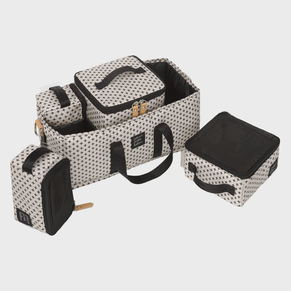 Inter-Mix Deluxe Kit in Positive print featuring packing cubes and a Grid Caddy for organized storage in diaper bags, strollers, and nurseries.