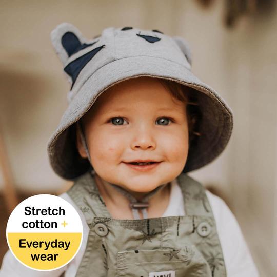 Toddler in a Bedhead Tiger Grey Marle Bucket Hat featuring a soft brim and adjustable chin strap, perfect for sun protection and comfort during outdoor adventures.