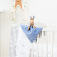 Load image into Gallery viewer, Peter Rabbit Comfort Blanket on crib bed, showcasing its softness and baby-safe features.
