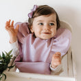 Load image into Gallery viewer, Lavender waterproof snuggle bib with pocket and adjustable strap, perfect for babies, BPA & Phthalate Free.
