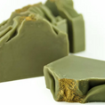 Load image into Gallery viewer, Australian Olive Green Clay Soap for acne, balancing oils, deep hydration, reduces scars. Suitable for normal to oily and combination skin. Scented with tea tree, eucalyptus, lavender, litsea cubebe.
