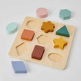 Load image into Gallery viewer, Shape Puzzle Wooden Toy showing different shapes and colors. Designed to enhance learning and coordination in children aged 12 months and up, crafted with non-toxic water-based paint.
